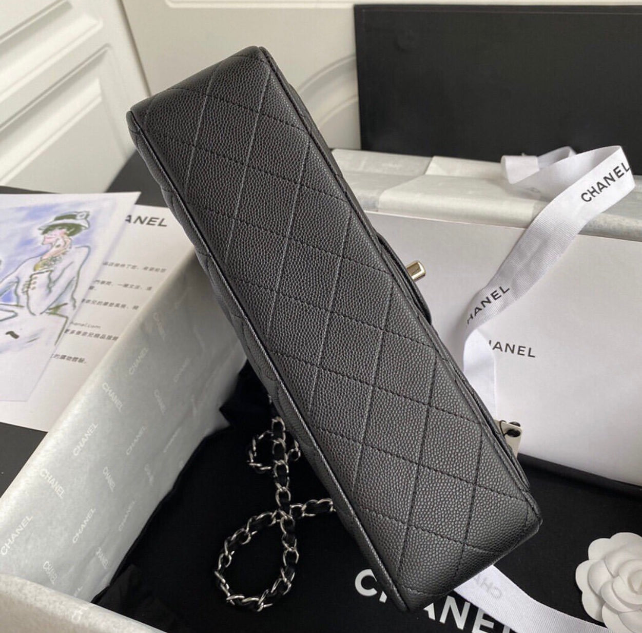 CHANEL Black Quilted Caviar
Leather Shoulder Bag with Silver Hardware