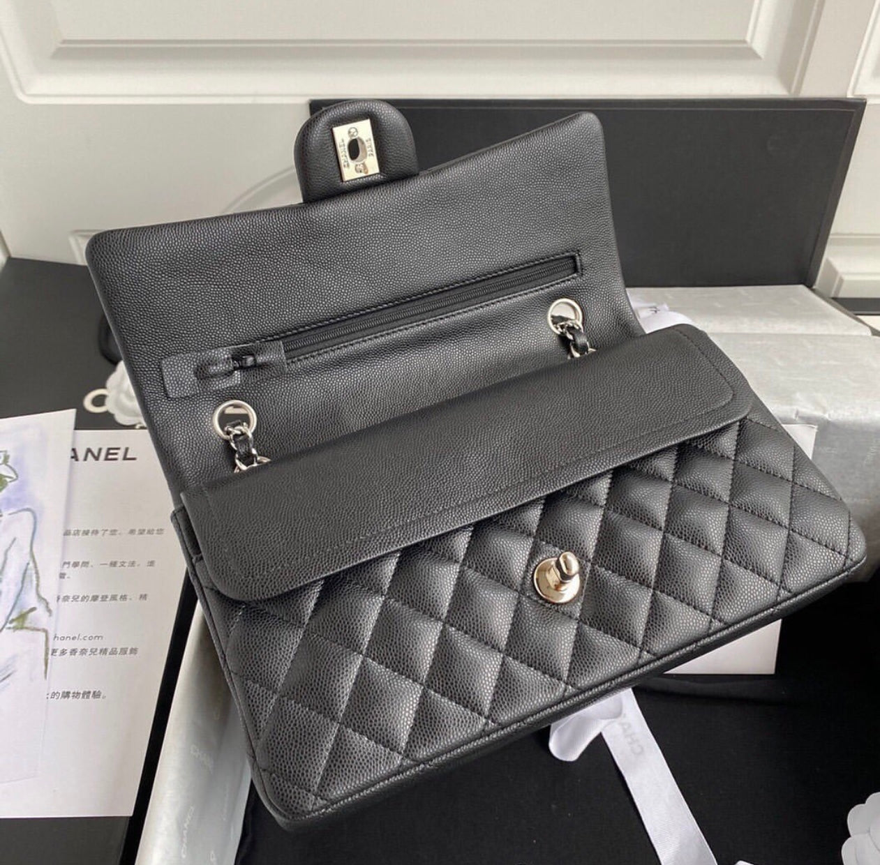 CHANEL Black Quilted Caviar
Leather Shoulder Bag with Silver Hardware